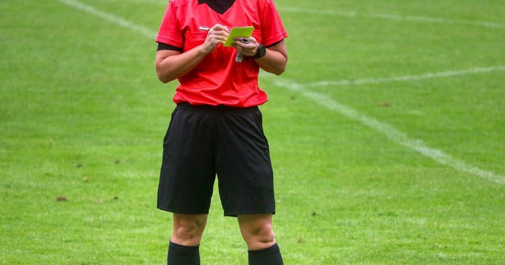 Referee giving yellow card disciplinary action and setting expectations